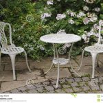 garden table and chairs bush garden hydrangea patio table ironwork paving plant flower chairless UUZZGTW