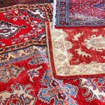 asian rugs for sale in the shop of fabrics and textiles - stock JEGSWTF