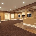 basement carpet lower level basement in earth tones and marble fireplace YJUDDEJ