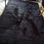 black rugs u0027special offeru0027 large black faux sheepskin shaggy fluffy rug 150 x 240cms OSAAMLM