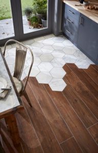 tile wood floor hexagon tiles meet traditional hardwood floors for a  stop-you-in-your-tracks look. the rest IBJTKVG