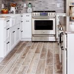 wood tile floors planks of wood-look tile flooring in a kitchen. DQDVJVK