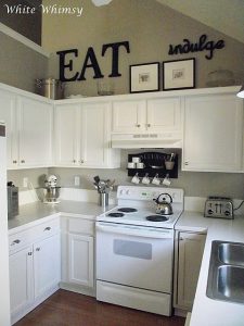 black accents, white cabinets! Really liking these small kitchens