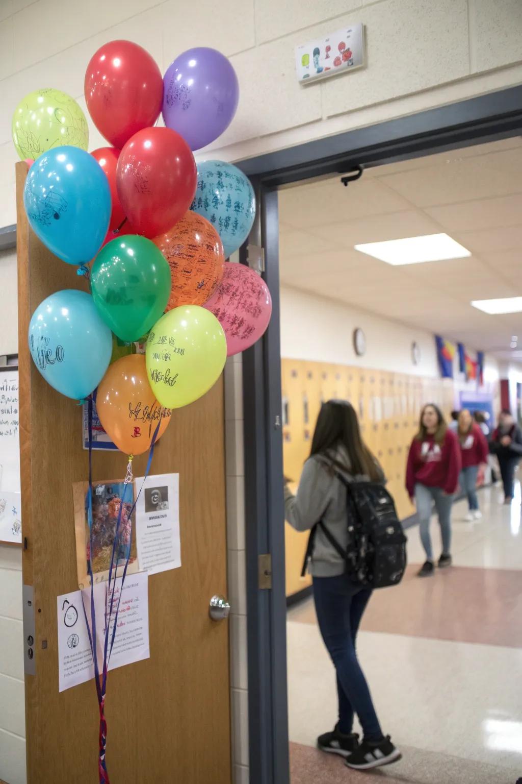 An interactive classroom door with balloons for students to write kind messages.