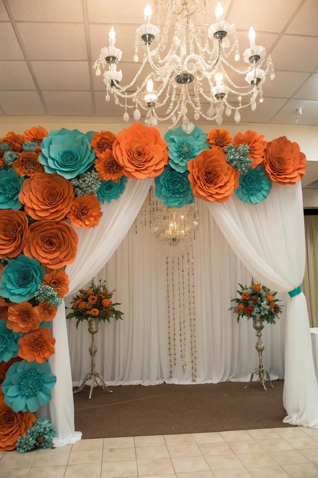A playful photo backdrop with burnt orange and teal flowers.