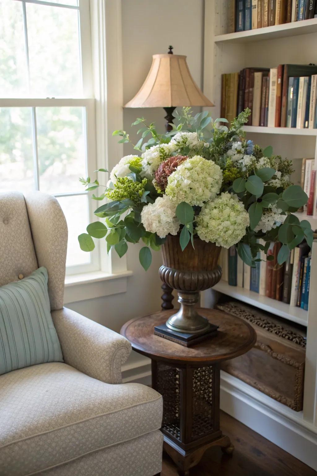 Gentle snowball hydrangeas paired with silver dollar eucalyptus in a seasonal planter.