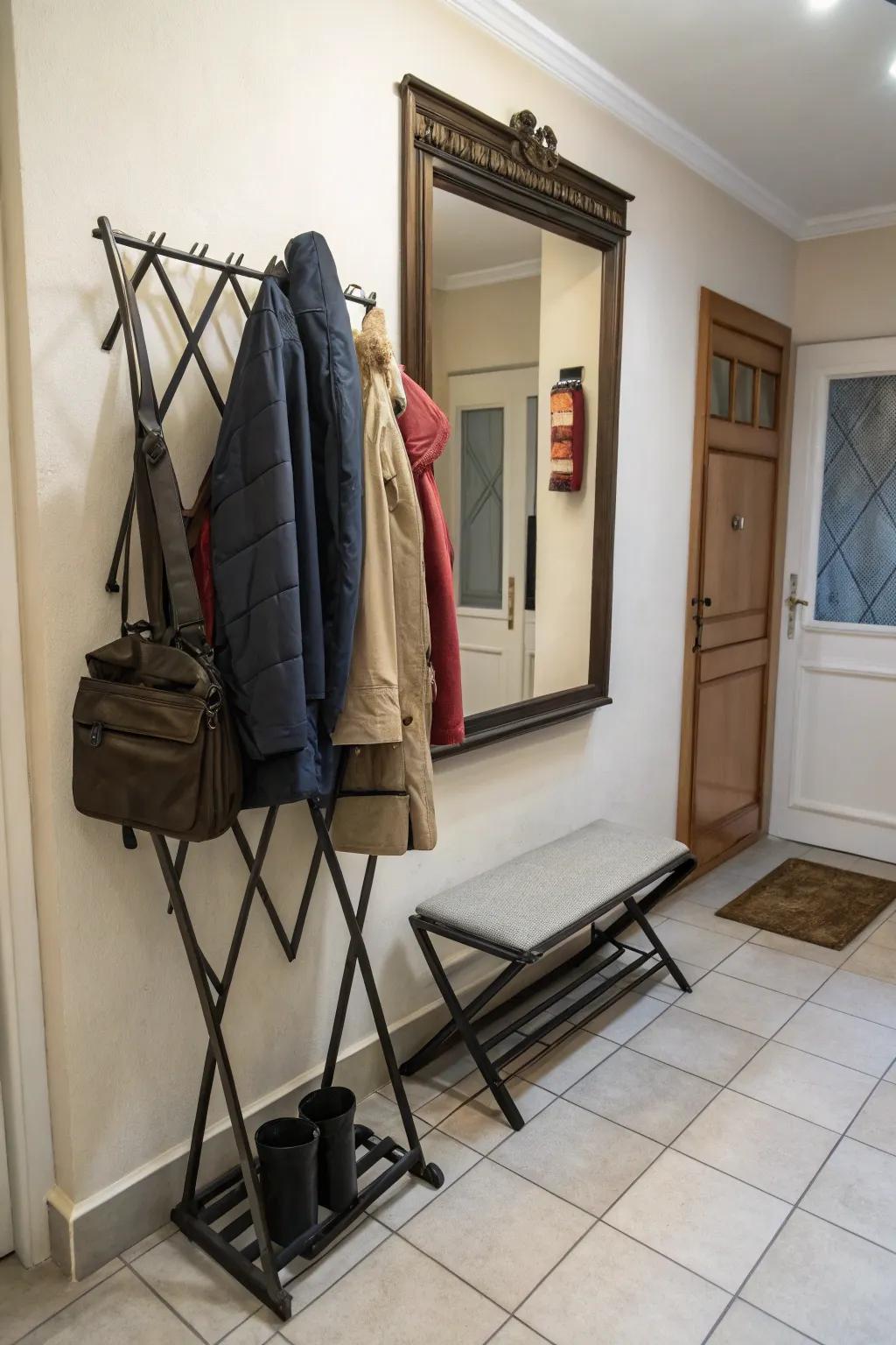 Foldable coat rack perfect for maximizing space in small entryways.