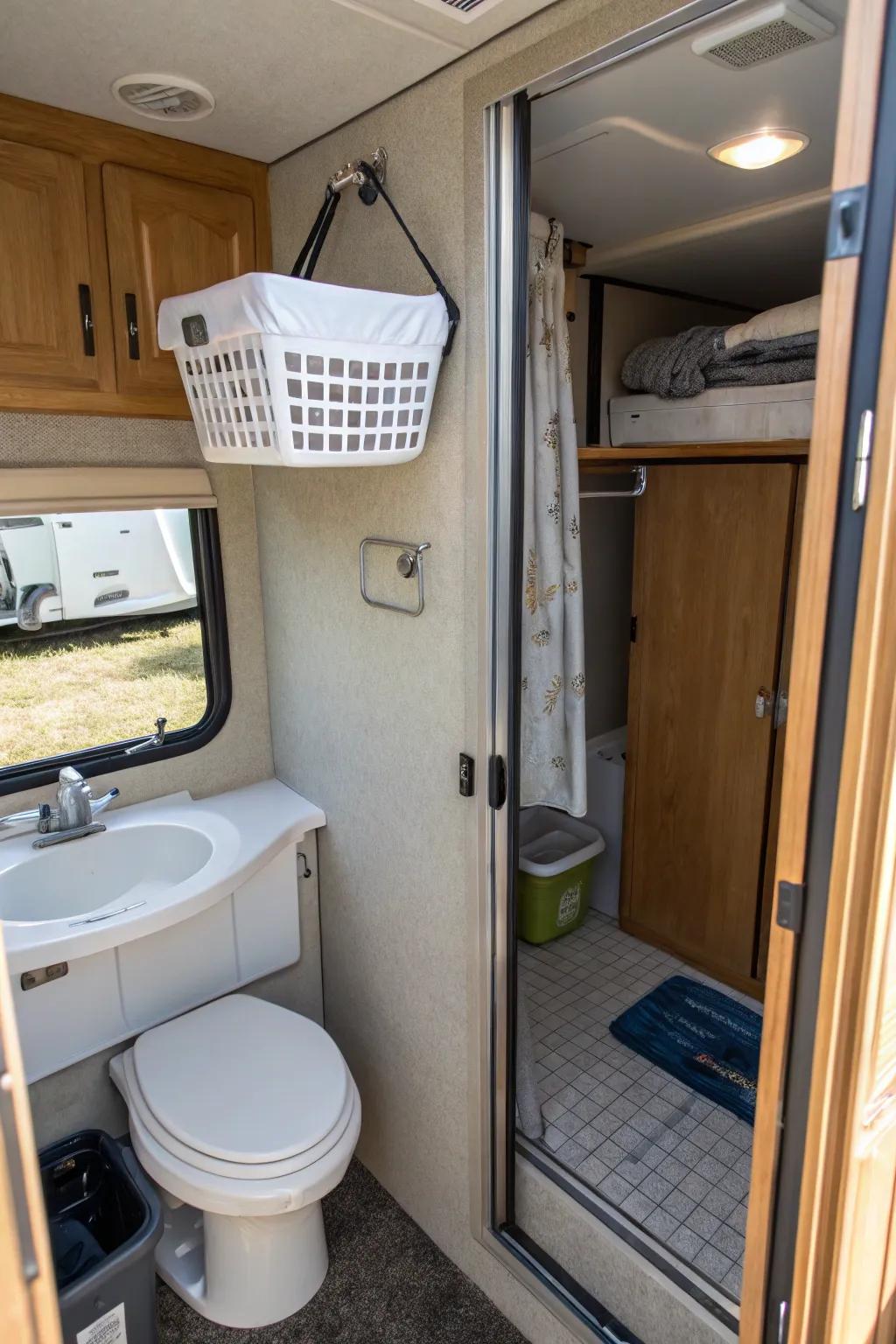 A hanging hamper over the door to save floor space in an RV.
